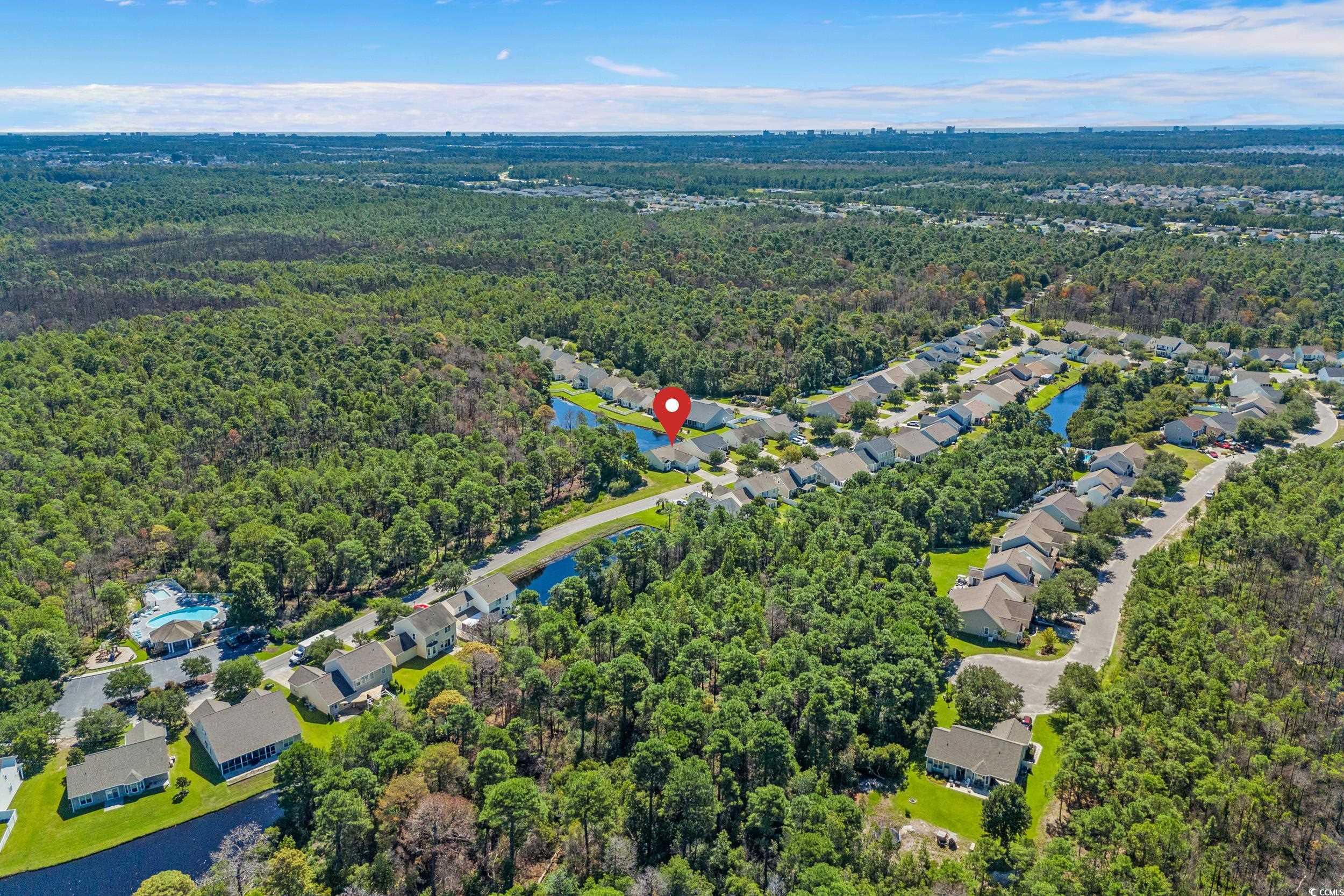 562 Tuckahoe Road Myrtle Beach, SC 29579 - Photo 34 of 40 Aerial view of property's location with a heavily wooded area and nearby suburban area
