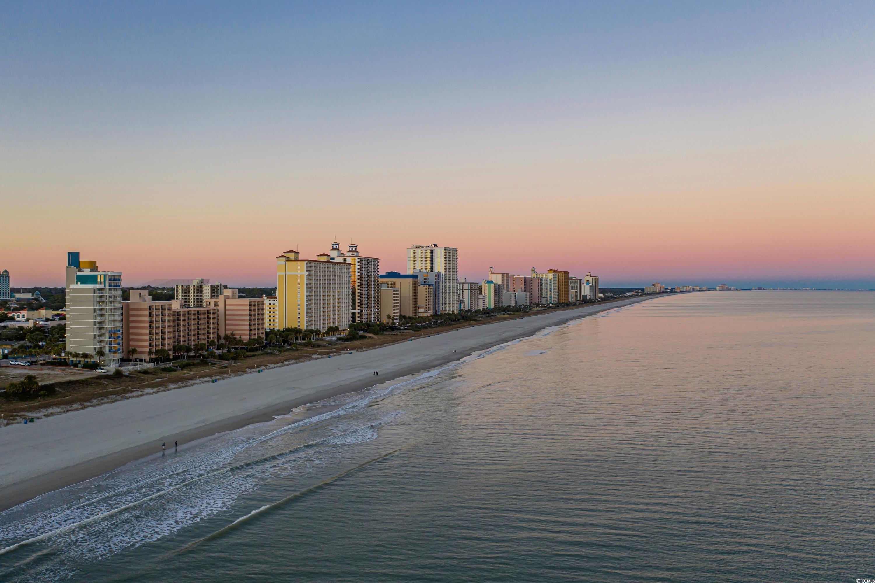562 Tuckahoe Road Myrtle Beach, SC 29579 - Photo 39 of 40 Aerial view at dusk of view of water and beach and a skyline view