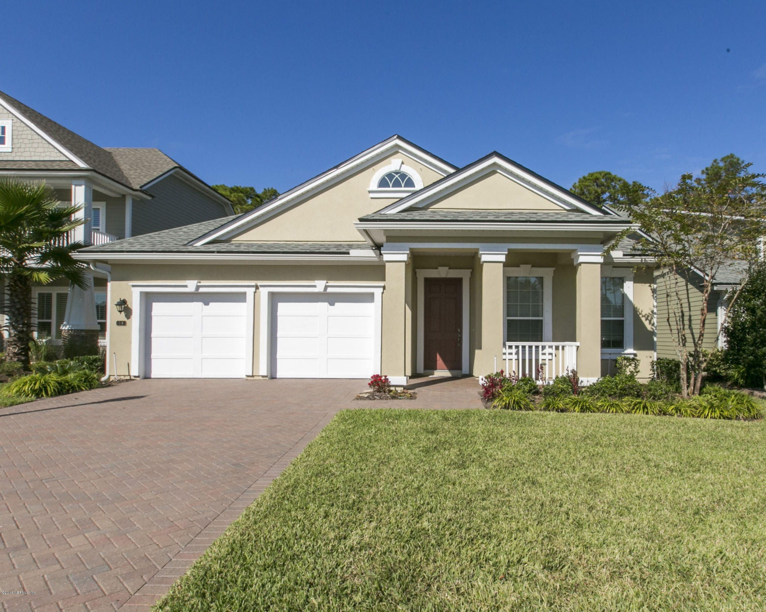 58 Pelican Pointe Road Ponte Vedra, FL 32081 - Photo 1 of 28 a front view of a house with a yard and garage