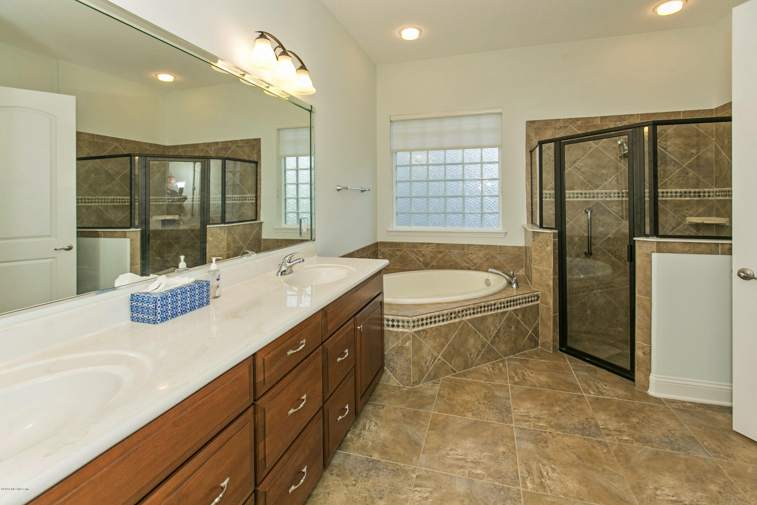 58 Pelican Pointe Road Ponte Vedra, FL 32081 - Photo 11 of 28 a spacious bathroom with a tub sink shower and mirror