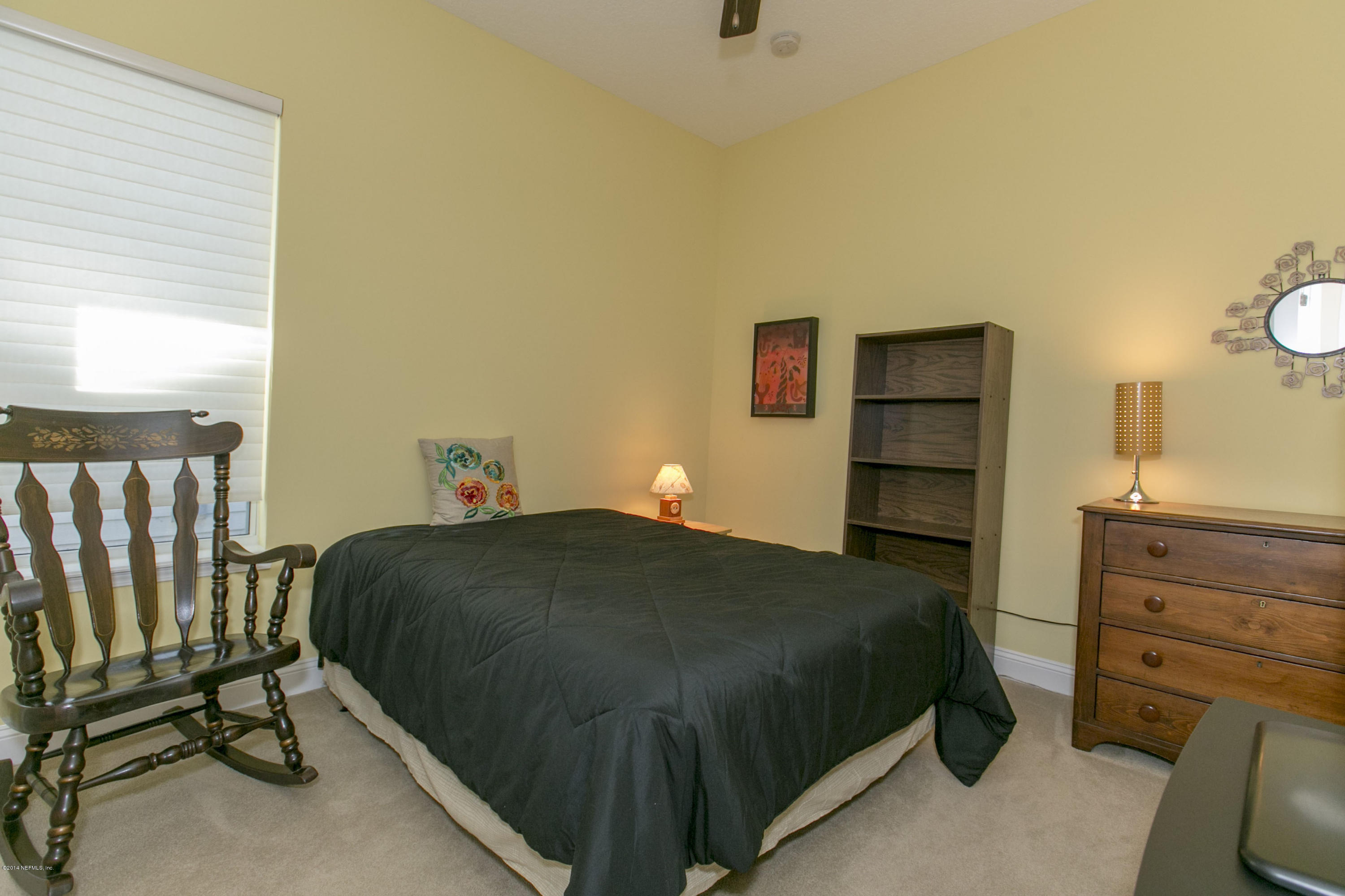 58 Pelican Pointe Road Ponte Vedra, FL 32081 - Photo 13 of 28 a bedroom with a bed and a cabinets
