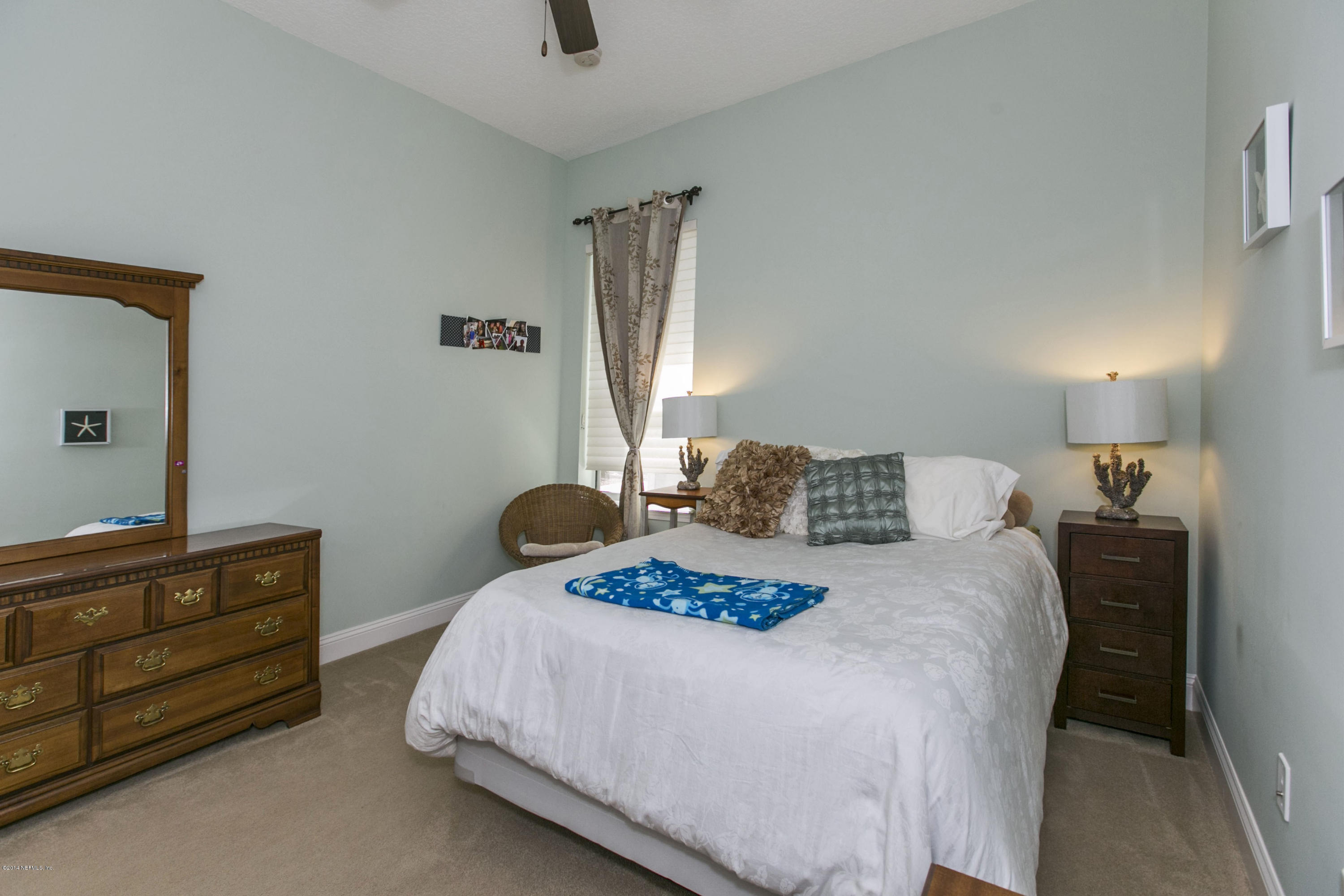 58 Pelican Pointe Road Ponte Vedra, FL 32081 - Photo 14 of 28 a bedroom with a bed and a dresser
