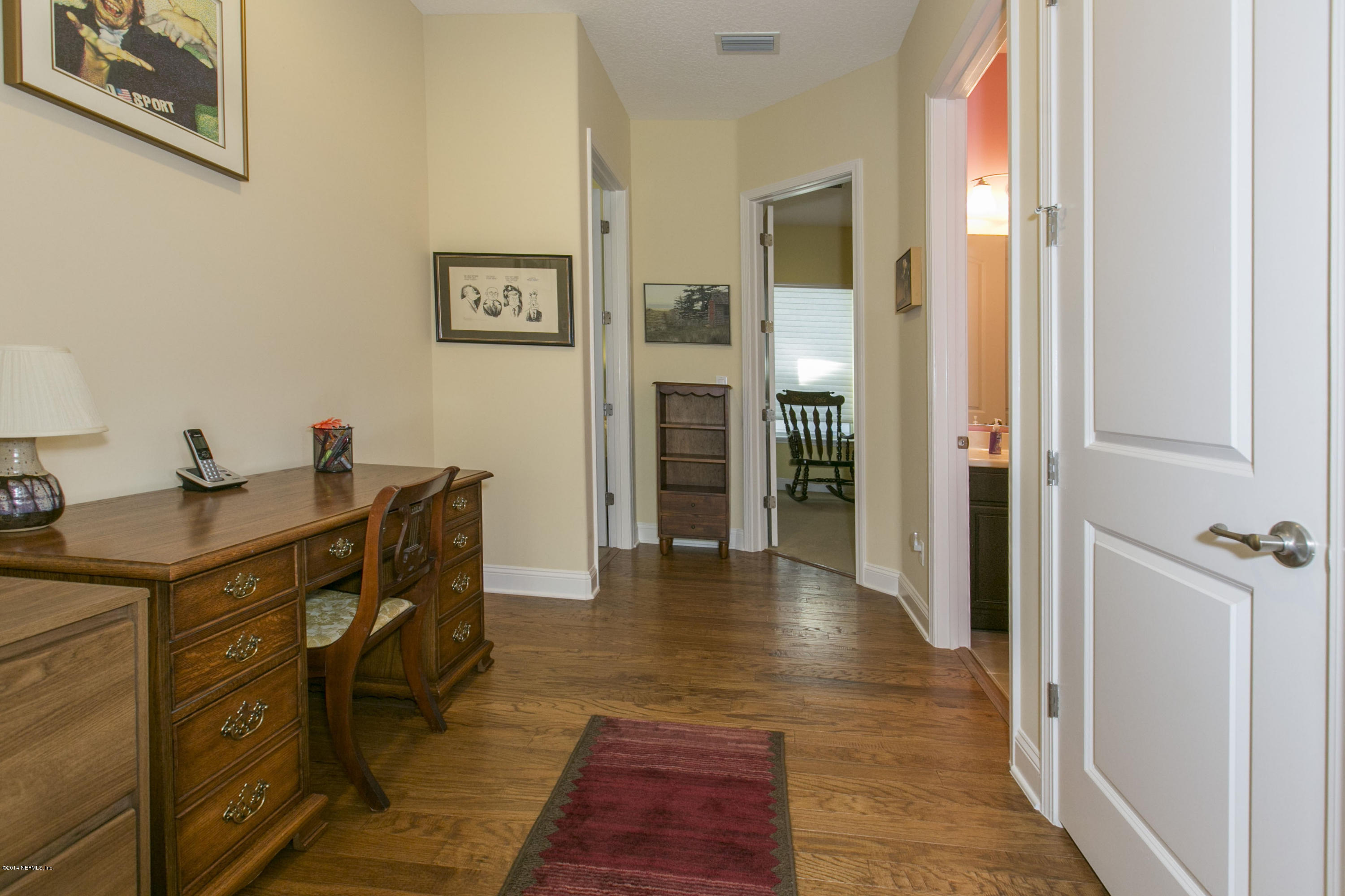 58 Pelican Pointe Road Ponte Vedra, FL 32081 - Photo 16 of 28 a view of a hallway with furniture and wooden floor