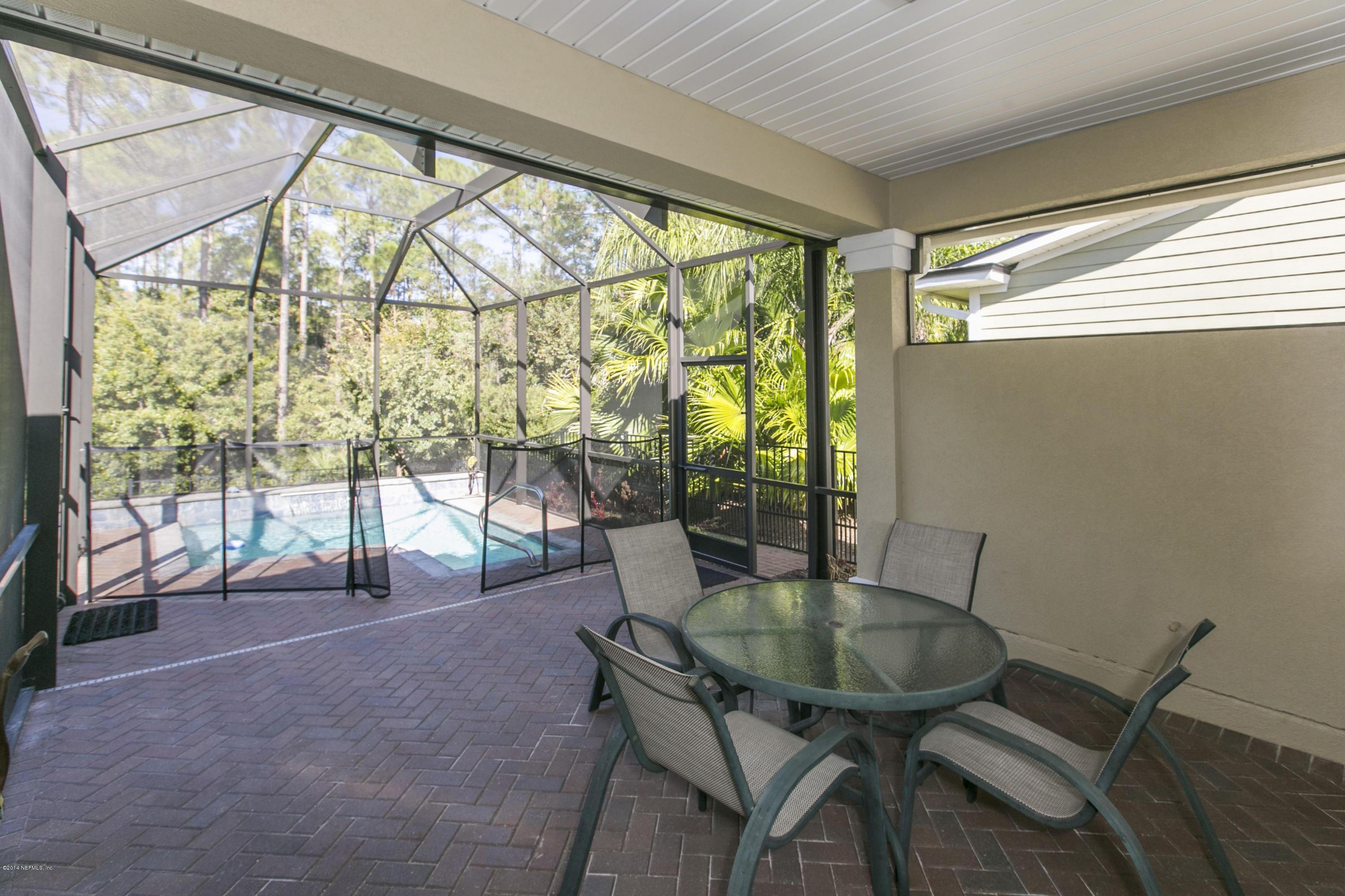 58 Pelican Pointe Road Ponte Vedra, FL 32081 - Photo 19 of 28 a dining room with glass top table and chairs