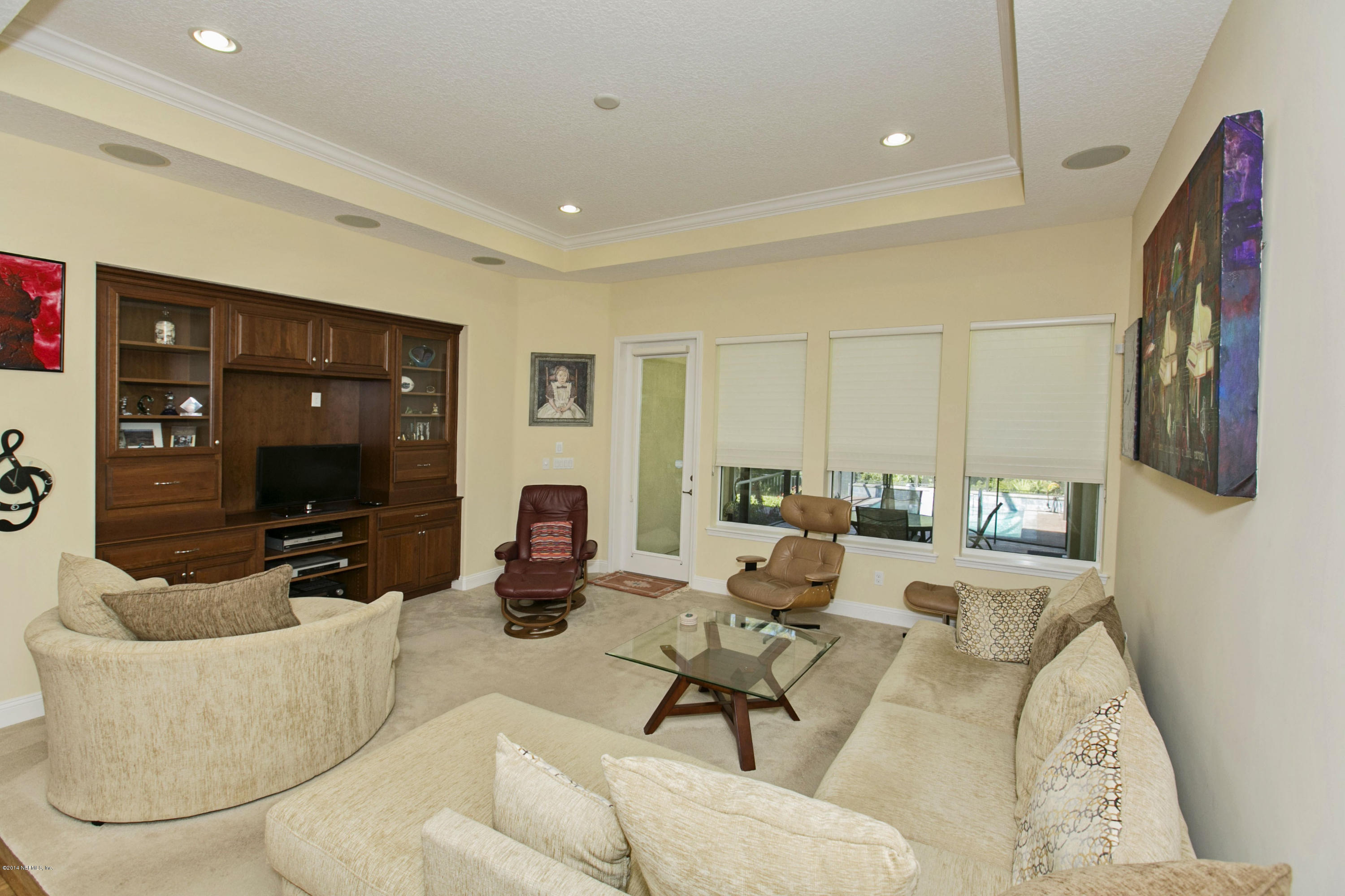 58 Pelican Pointe Road Ponte Vedra, FL 32081 - Photo 9 of 28 a living room with furniture and a flat screen tv
