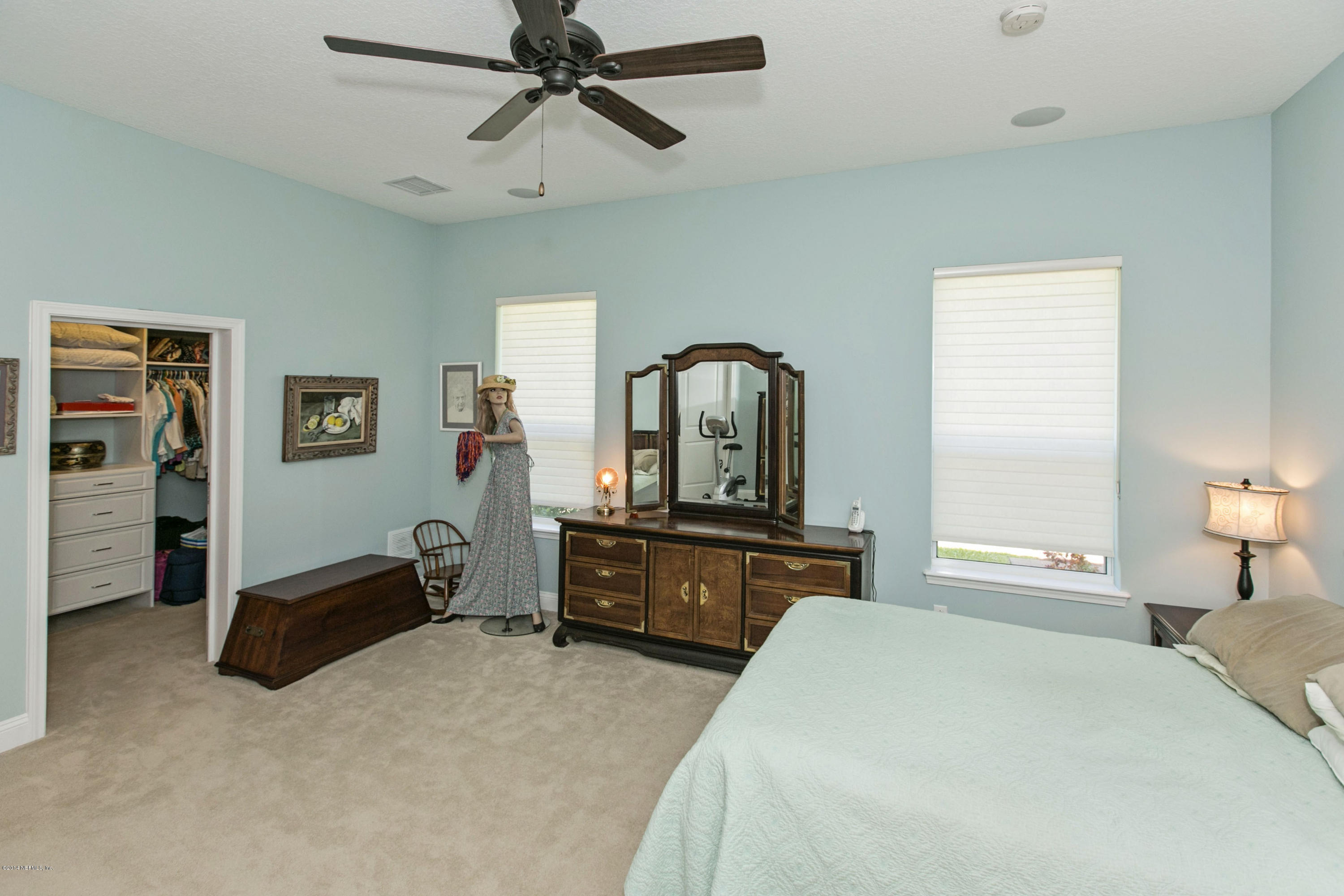 58 Pelican Pointe Road Ponte Vedra, FL 32081 - Photo 10 of 28 a bedroom with a bed and dresser with mirror