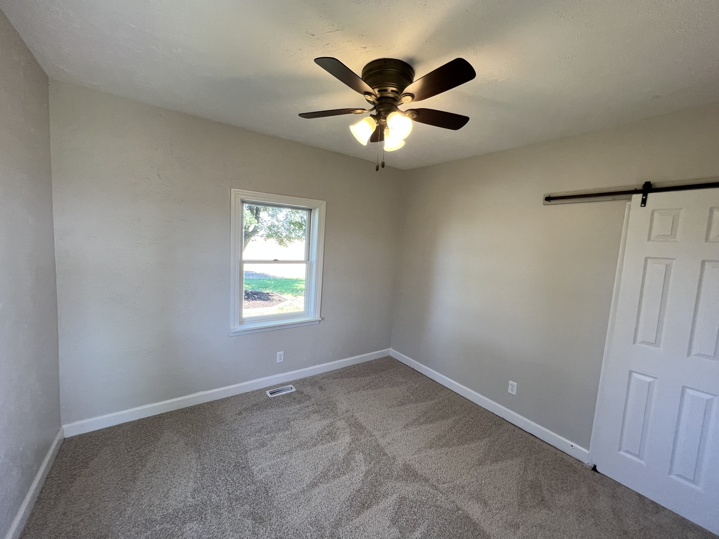 1980 West Grand Ridge Road Mazon, IL 60444 - Photo 11 of 21 a view of a big room with a chandelier fan and windows