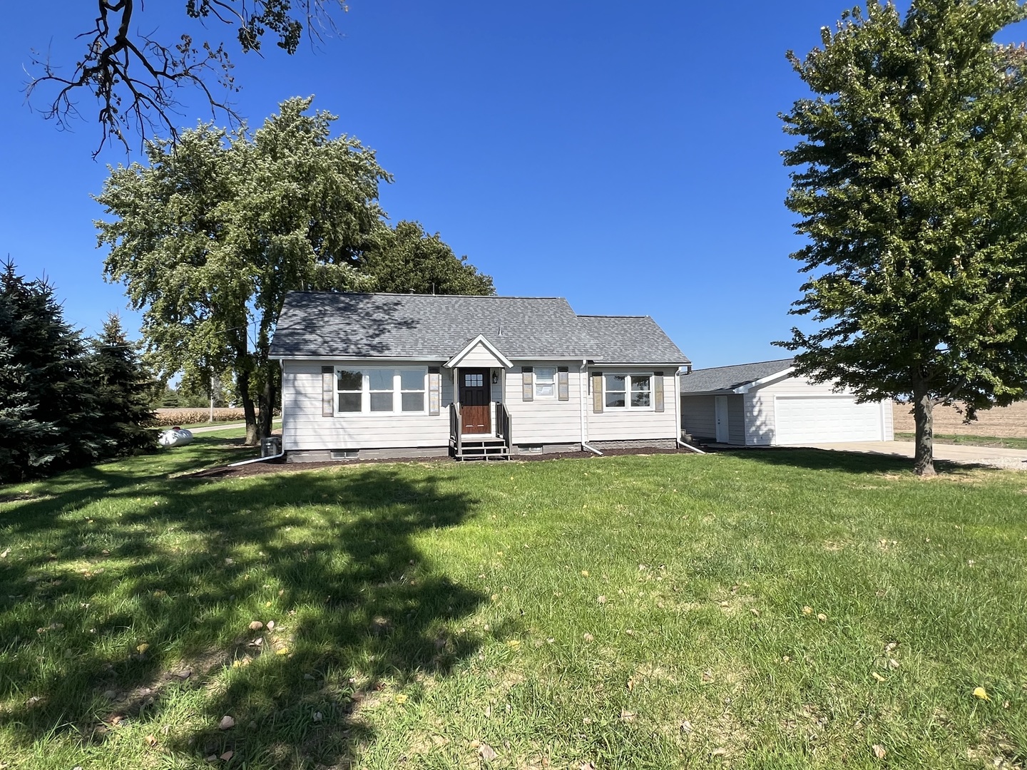 1980 West Grand Ridge Road Mazon, IL 60444 - Photo 14 of 21 a view of a house with a big yard potted plants and large tree