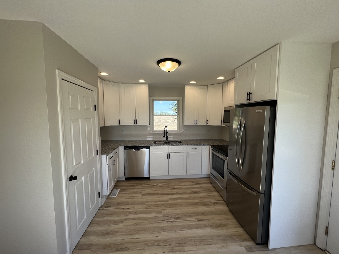 1980 West Grand Ridge Road Mazon, IL 60444 - Photo 2 of 21 a kitchen with a refrigerator a sink and cabinets