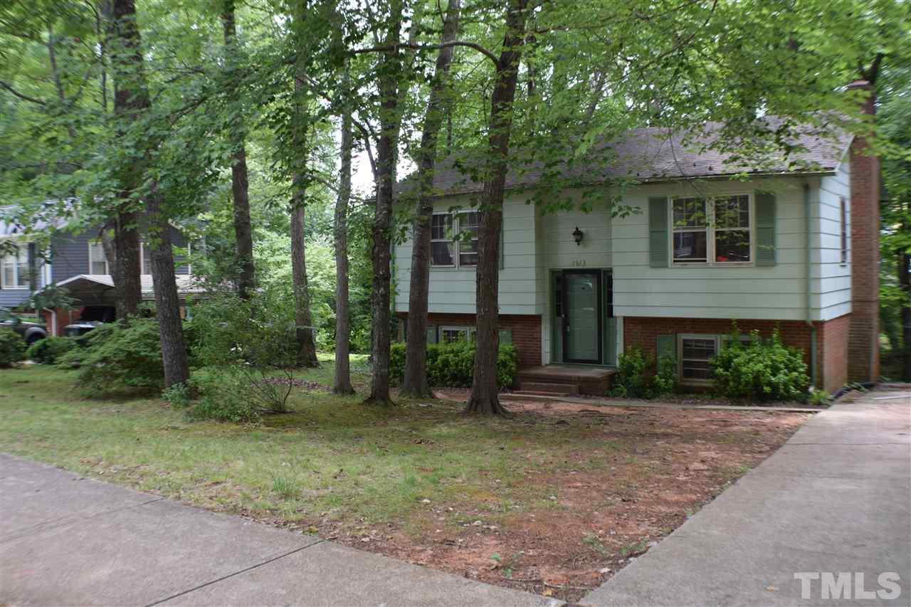 7613 Mine Valley Road Raleigh, NC 27615 - Photo 1 of 24 a front view of a house with garden