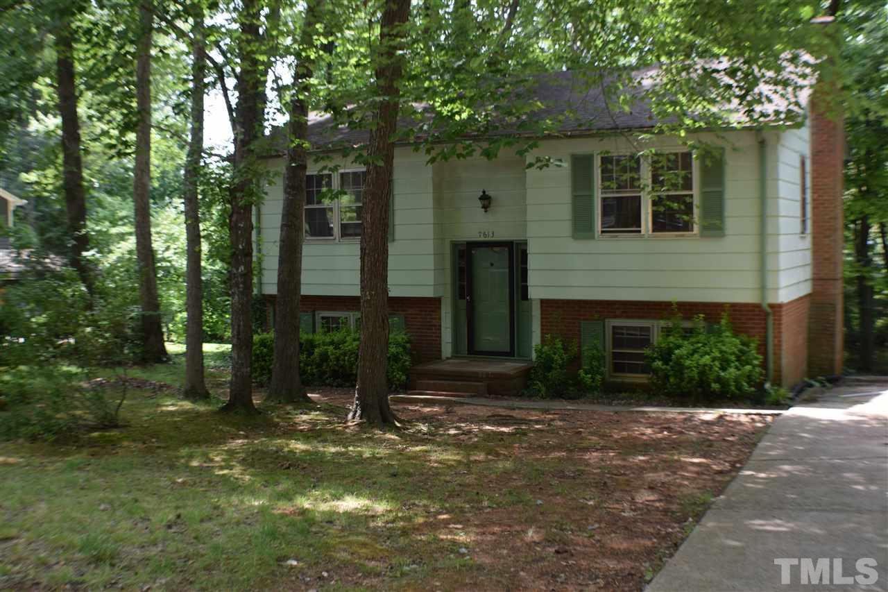 7613 Mine Valley Road Raleigh, NC 27615 - Photo 2 of 24 a front view of a house with garden