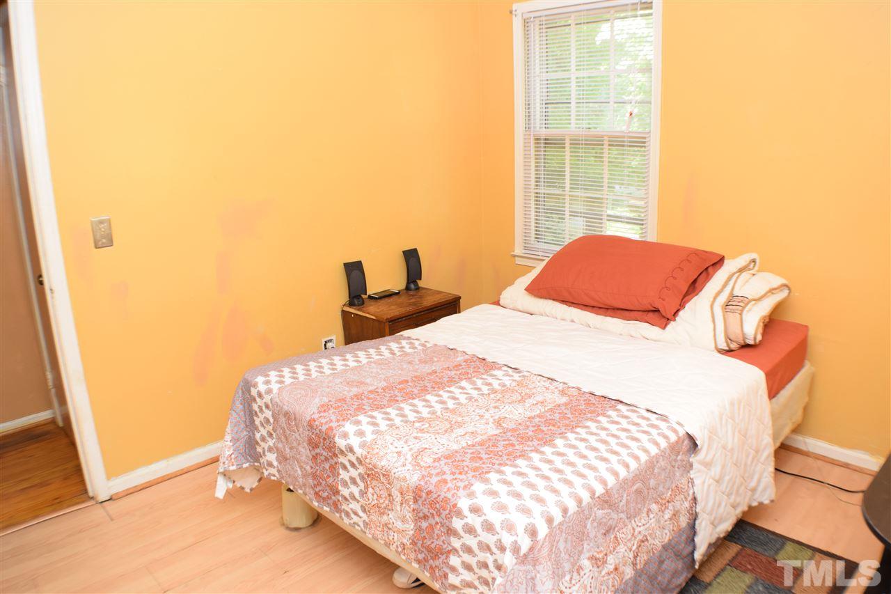 7613 Mine Valley Road Raleigh, NC 27615 - Photo 12 of 24 a bedroom with a bed and a window