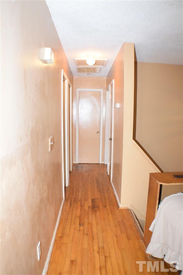 7613 Mine Valley Road Raleigh, NC 27615 - Photo 13 of 24 a view of a room with wooden floor