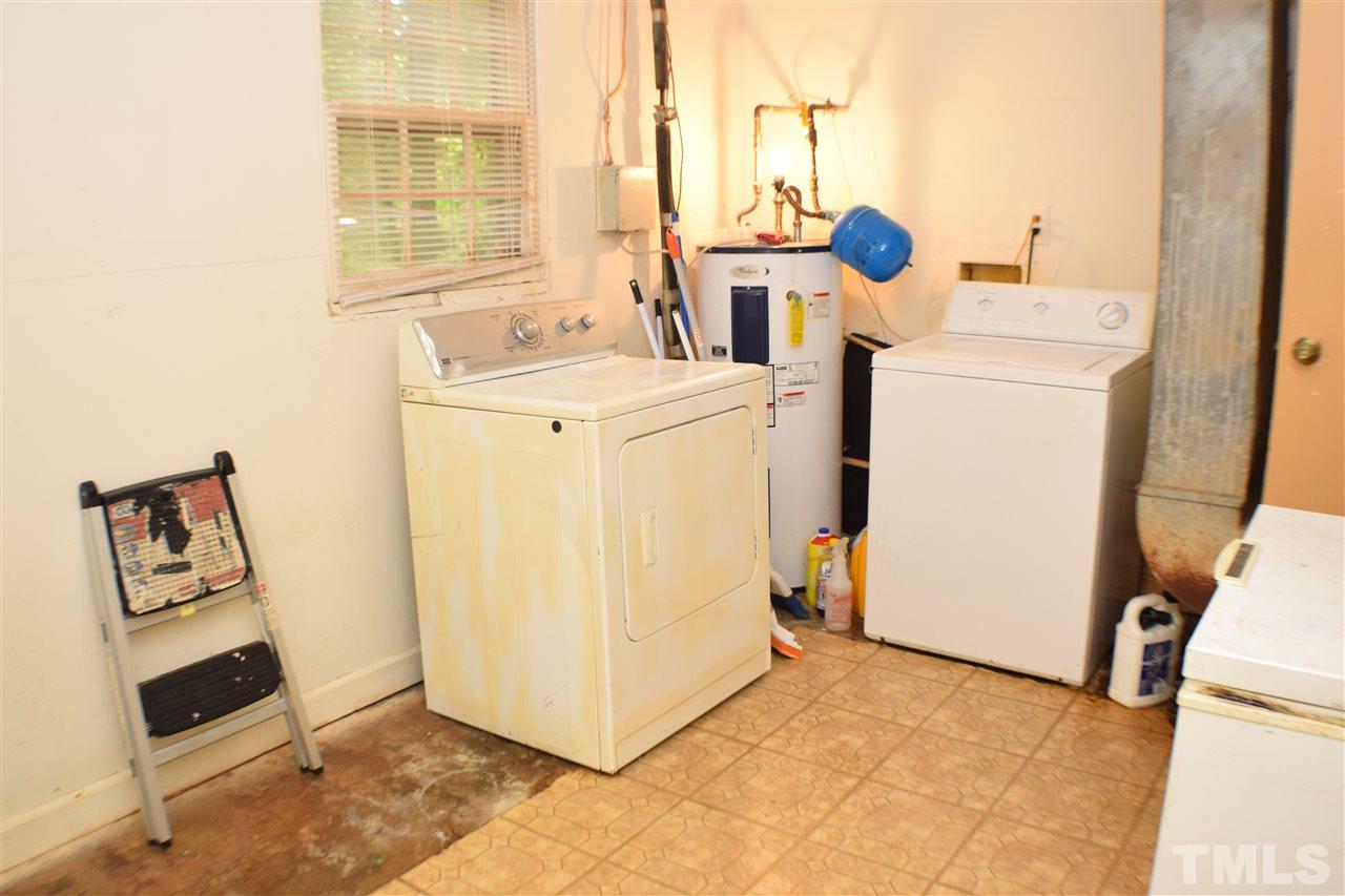 7613 Mine Valley Road Raleigh, NC 27615 - Photo 22 of 24 a utility room with dryer and washer