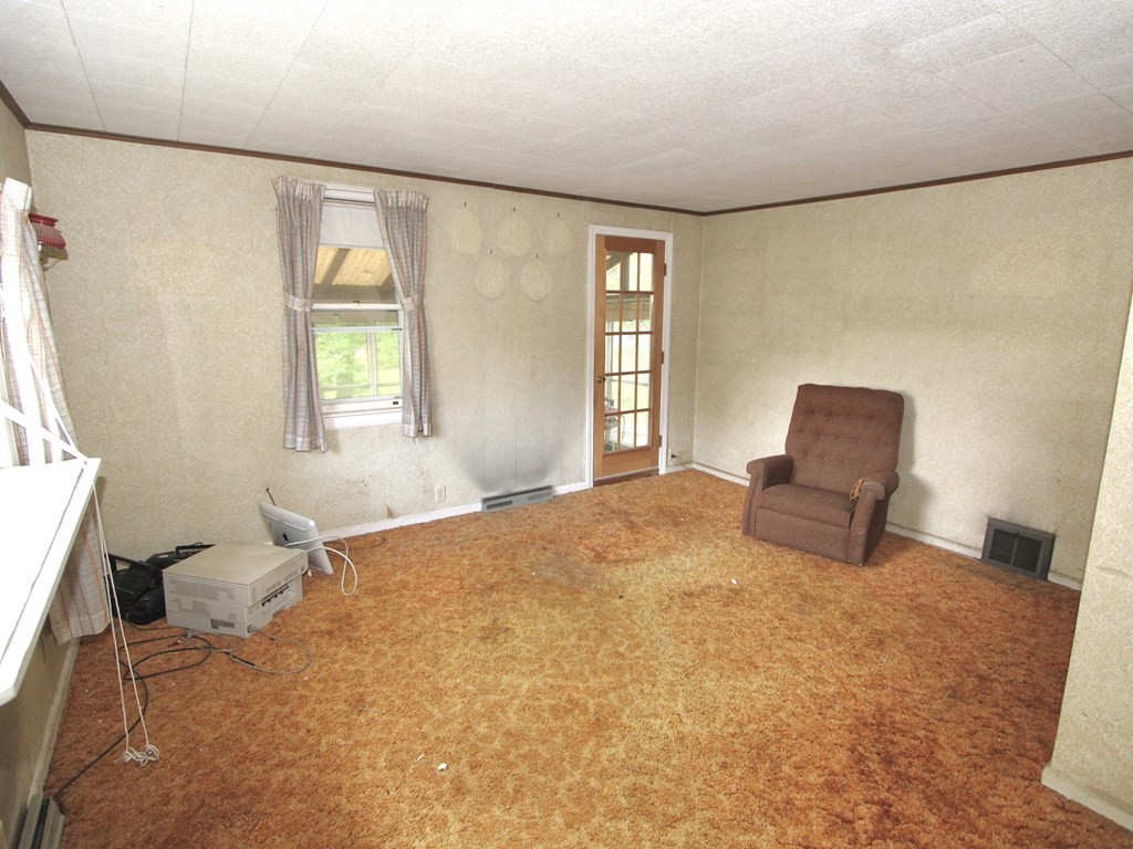 171 Chapel Street Leicester, MA 01524 - Photo 2 of 10 a bedroom with a bed and a window