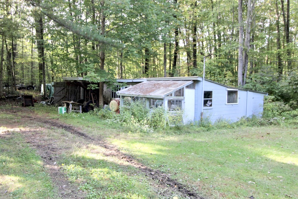 171 Chapel Street Leicester, MA 01524 - Photo 6 of 10 a view of a house with backyard and sitting area