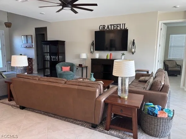 a living room with furniture and a large window