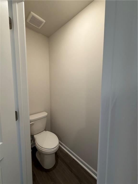 79 Holland Cove Winder, GA 30680 - Photo 16 of 25 a white toilet sitting next to a white sink