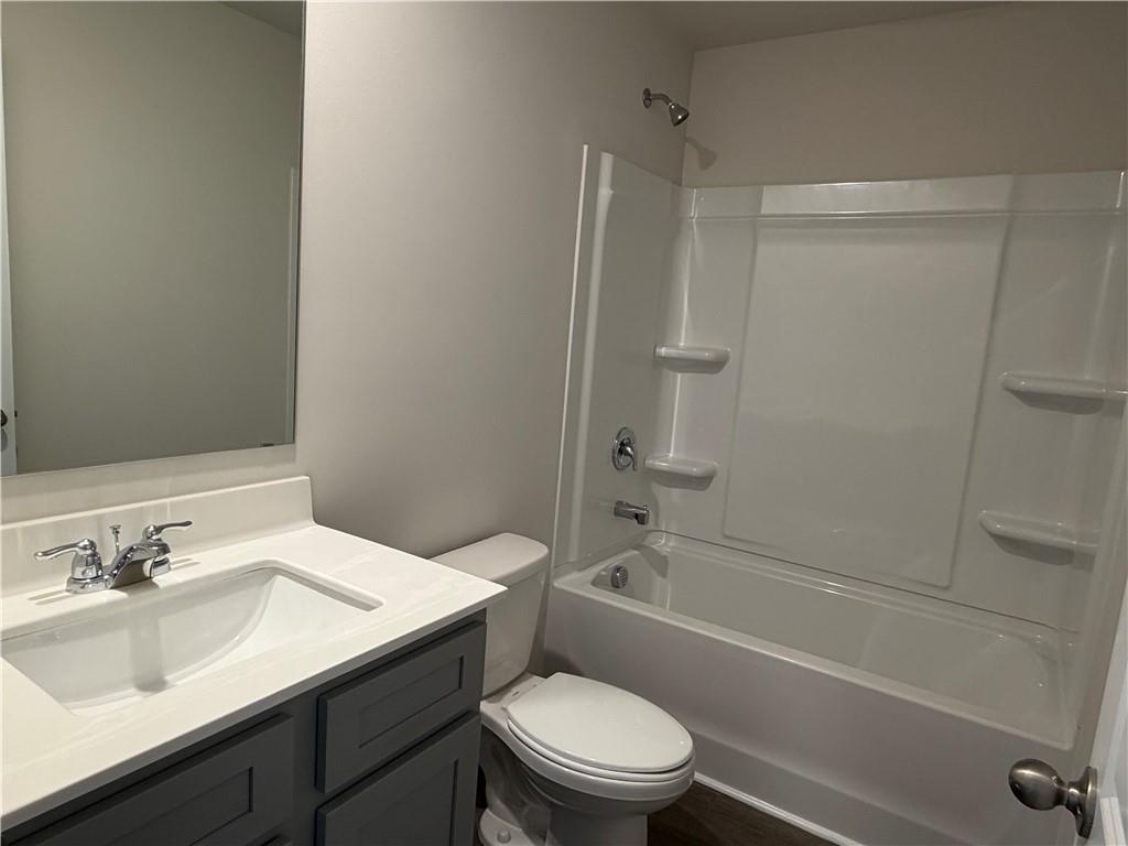 79 Holland Cove Winder, GA 30680 - Photo 17 of 25 a bathroom with a sink toilet vanity and shower