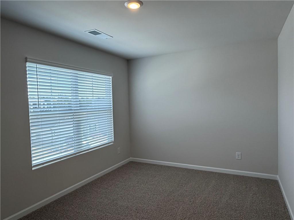 79 Holland Cove Winder, GA 30680 - Photo 18 of 25 an empty room with a window