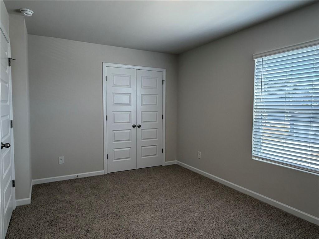 79 Holland Cove Winder, GA 30680 - Photo 19 of 25 an empty room with windows