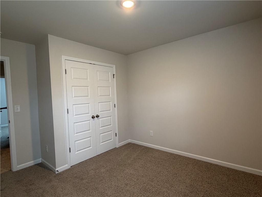79 Holland Cove Winder, GA 30680 - Photo 21 of 25 an empty room with closet