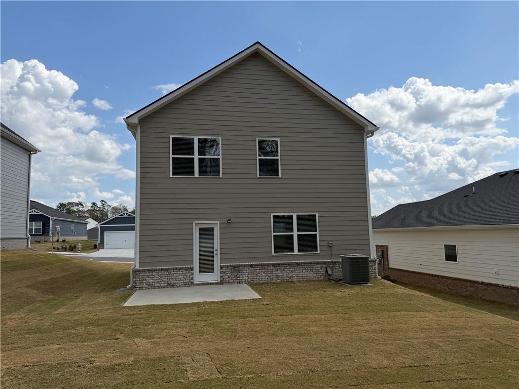 79 Holland Cove Winder, GA 30680 - Photo 24 of 25 a view of a house with a backyard