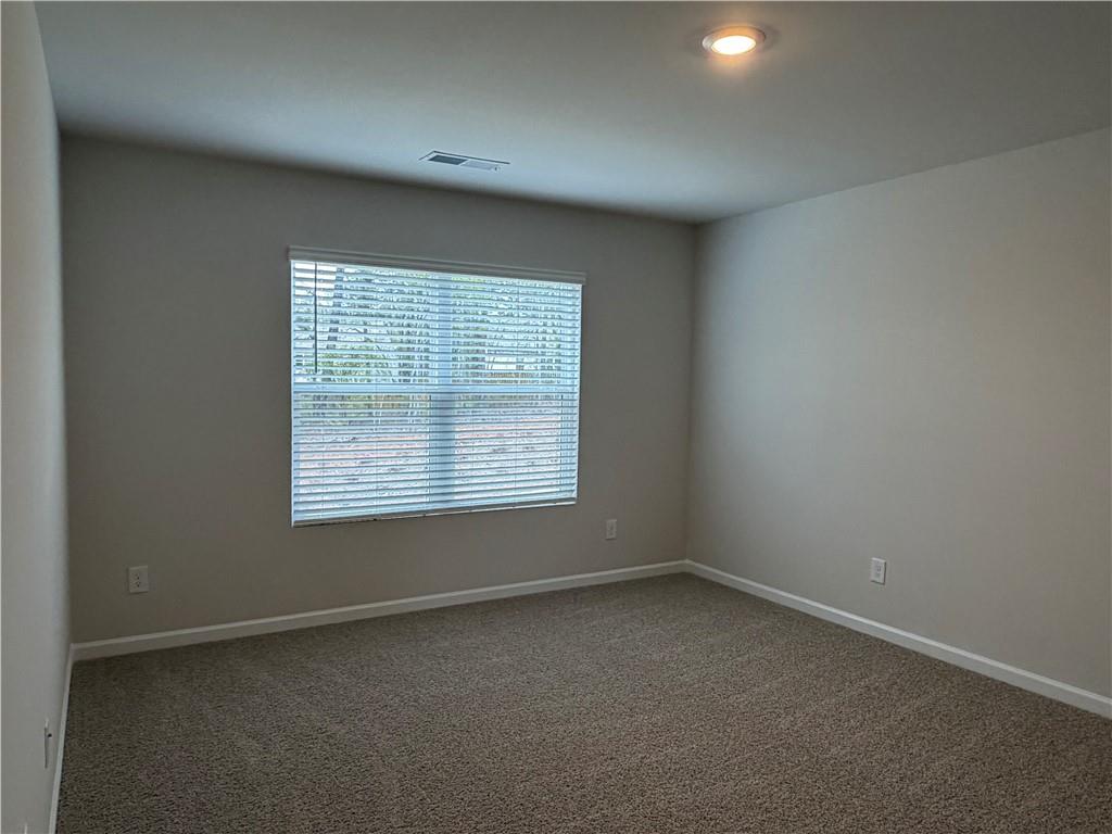 79 Holland Cove Winder, GA 30680 - Photo 10 of 25 an empty room with a window