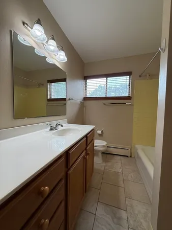 a bathroom with a sink a vanity and a mirror