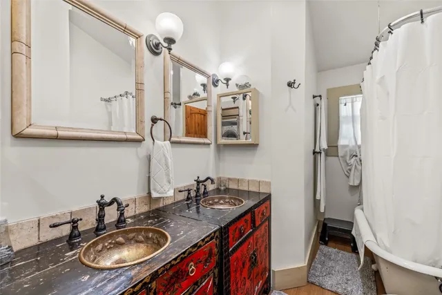 a bathroom with a sink double vanity and a mirror