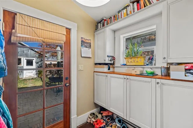 a kitchen with refrigerator and window