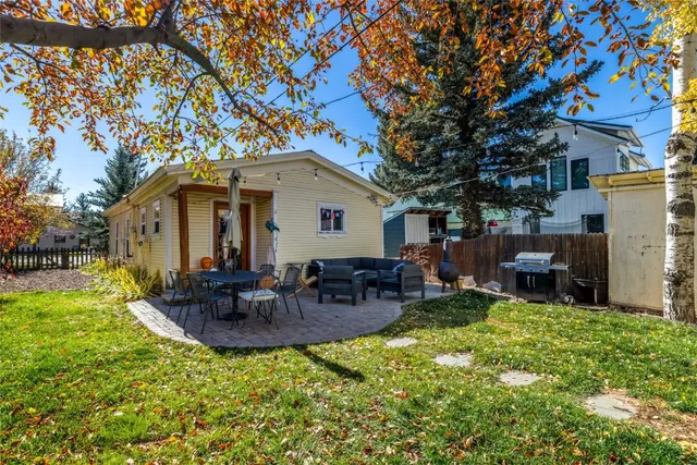 a backyard of a house with seating space