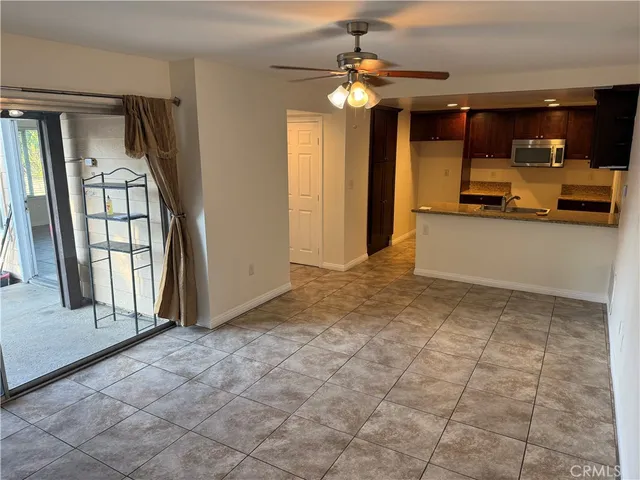 a view of a kitchen with a sink and cabinets
