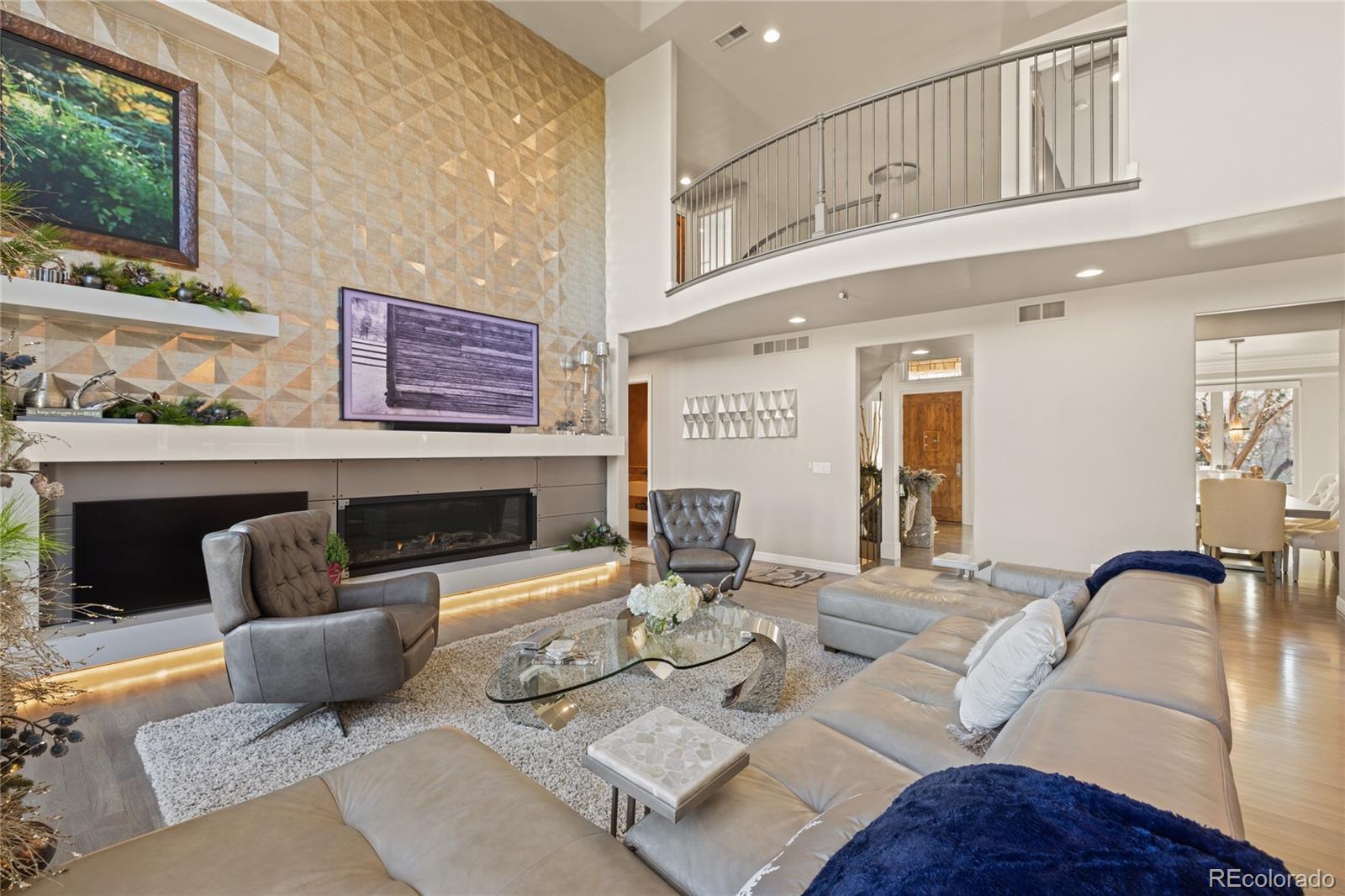 8751 Crooked Stick Place Lone Tree, CO 80124 - Photo 13 of 50 a living room with furniture and a fireplace