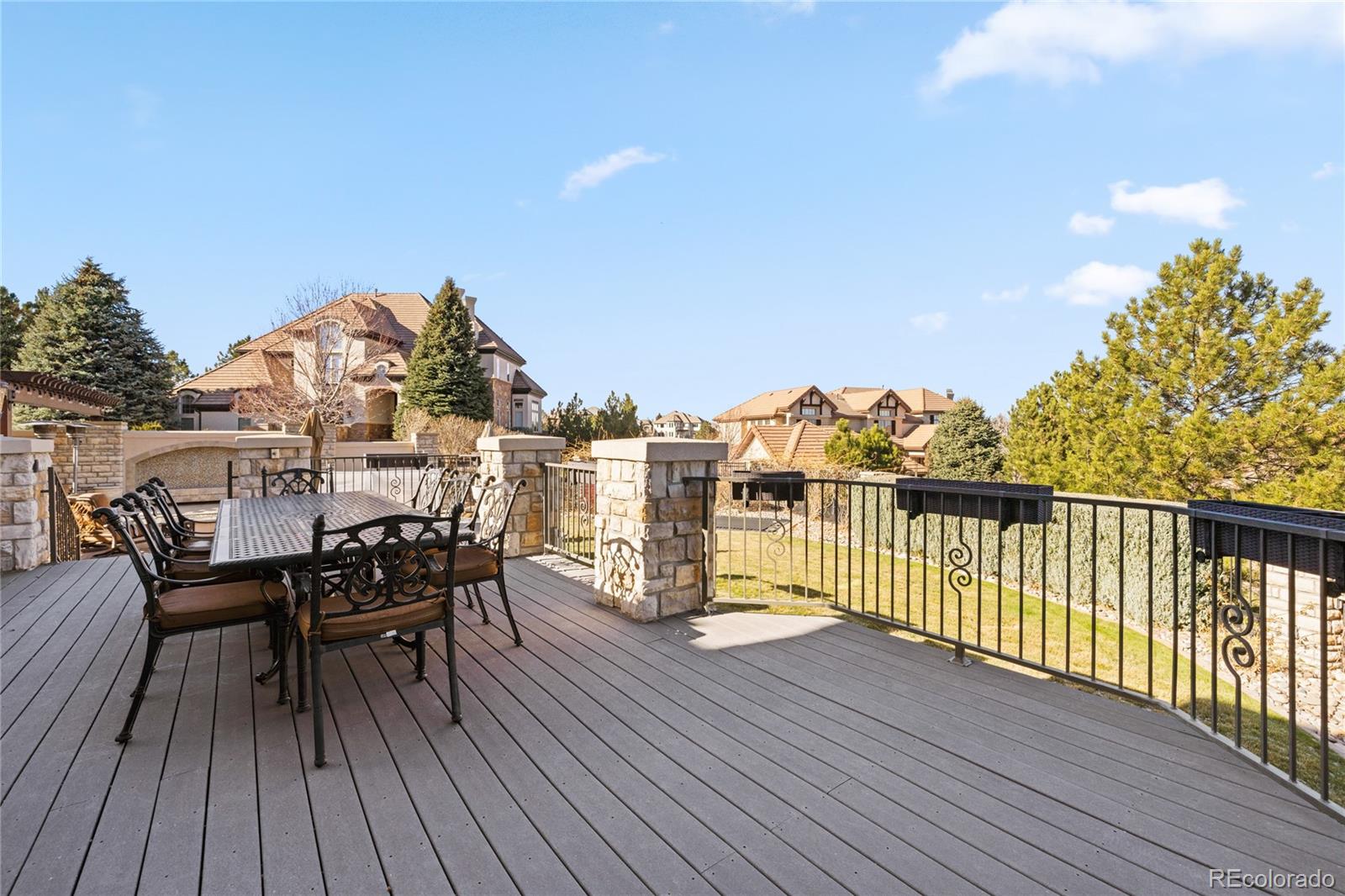 8751 Crooked Stick Place Lone Tree, CO 80124 - Photo 21 of 50 a view of a balcony with furniture and wooden floor