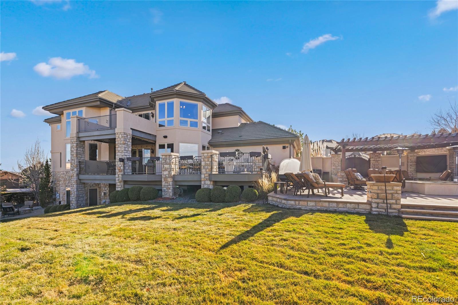 8751 Crooked Stick Place Lone Tree, CO 80124 - Photo 24 of 50 a front view of house swimming pool with outdoor seating