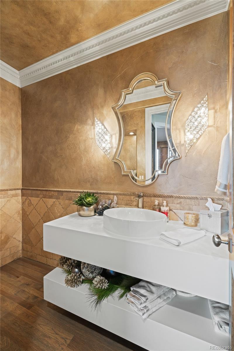 8751 Crooked Stick Place Lone Tree, CO 80124 - Photo 30 of 50 a bathroom with a sink and a mirror
