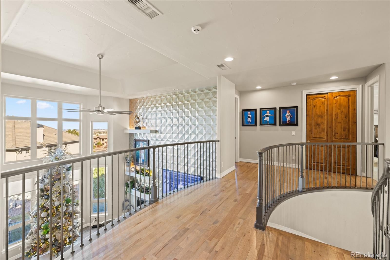 8751 Crooked Stick Place Lone Tree, CO 80124 - Photo 31 of 50 a view of balcony with wooden floor
