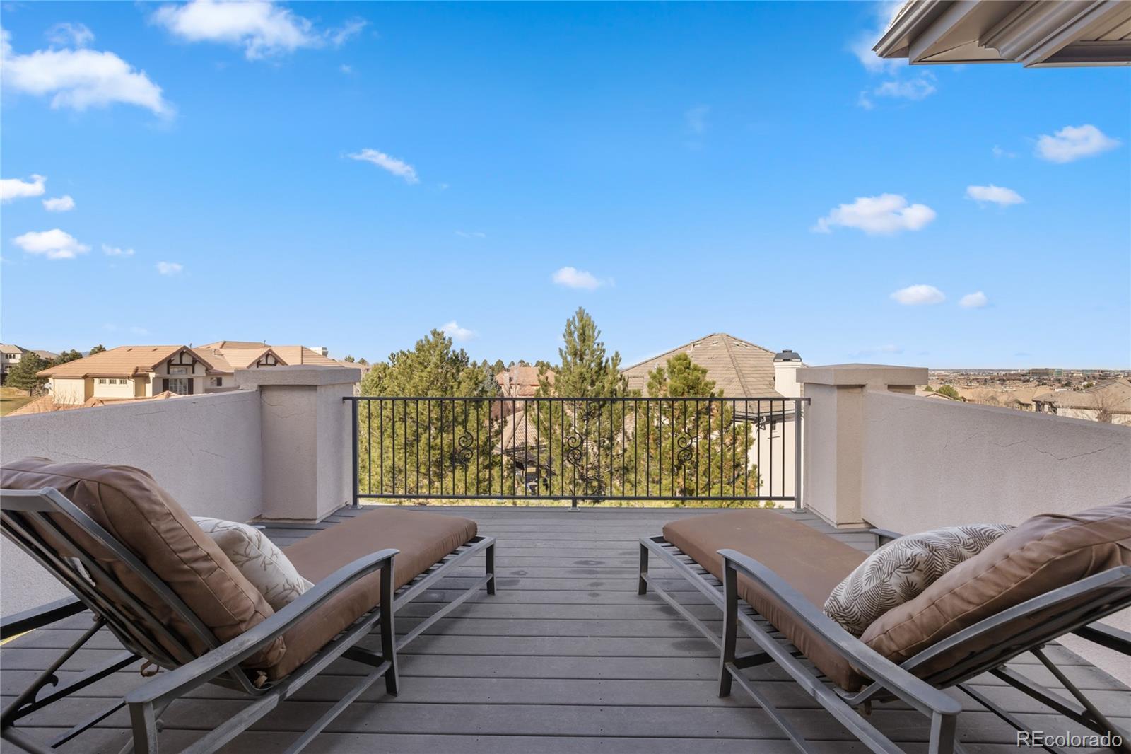 8751 Crooked Stick Place Lone Tree, CO 80124 - Photo 34 of 50 a view of a balcony with furniture