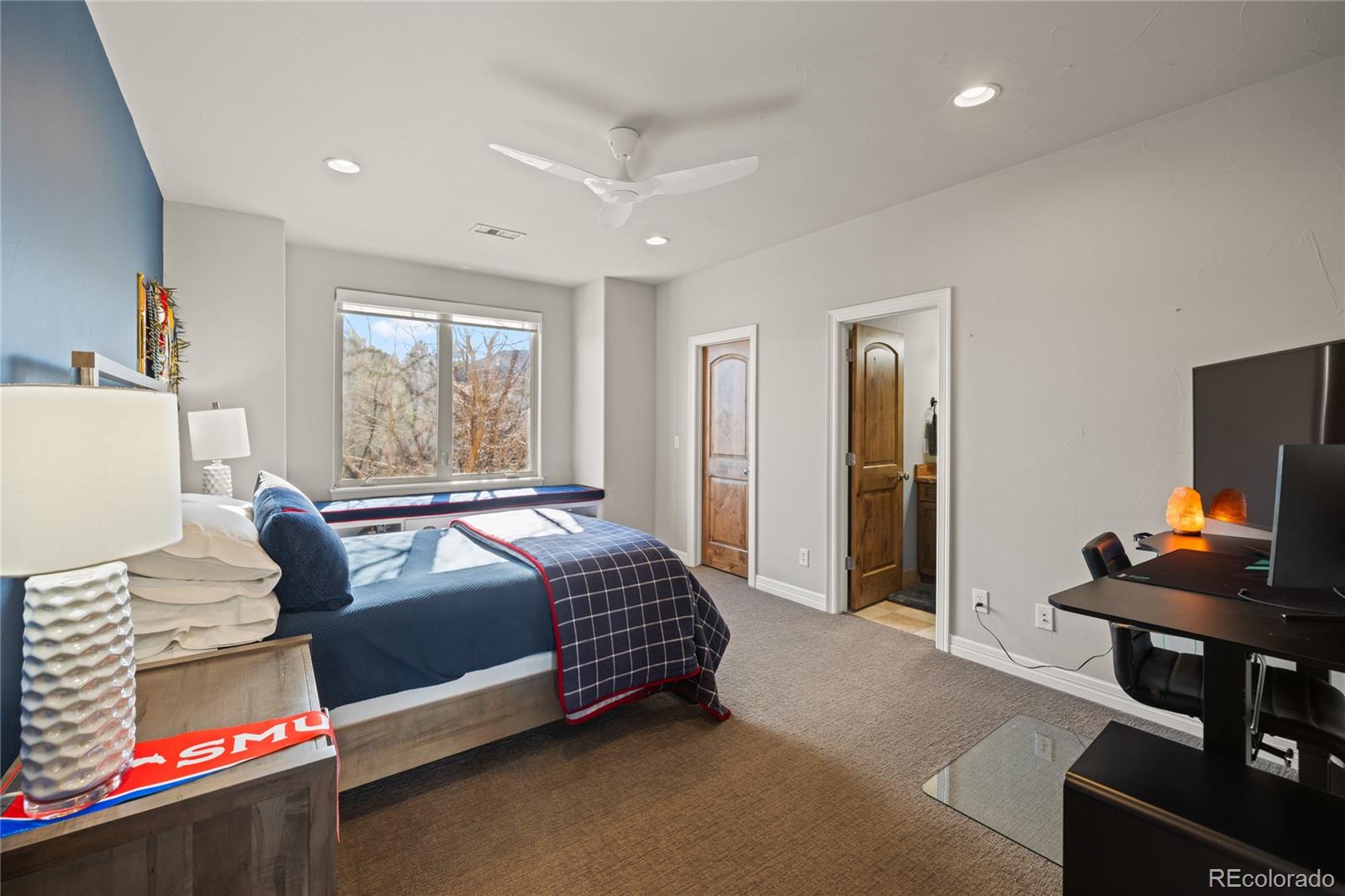 8751 Crooked Stick Place Lone Tree, CO 80124 - Photo 39 of 50 a bedroom with bed and a window