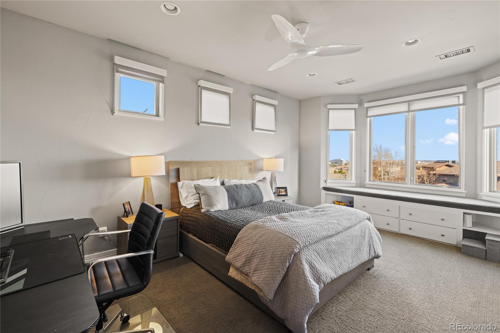 8751 Crooked Stick Place Lone Tree, CO 80124 - Photo 42 of 50 a bedroom with a bed and window