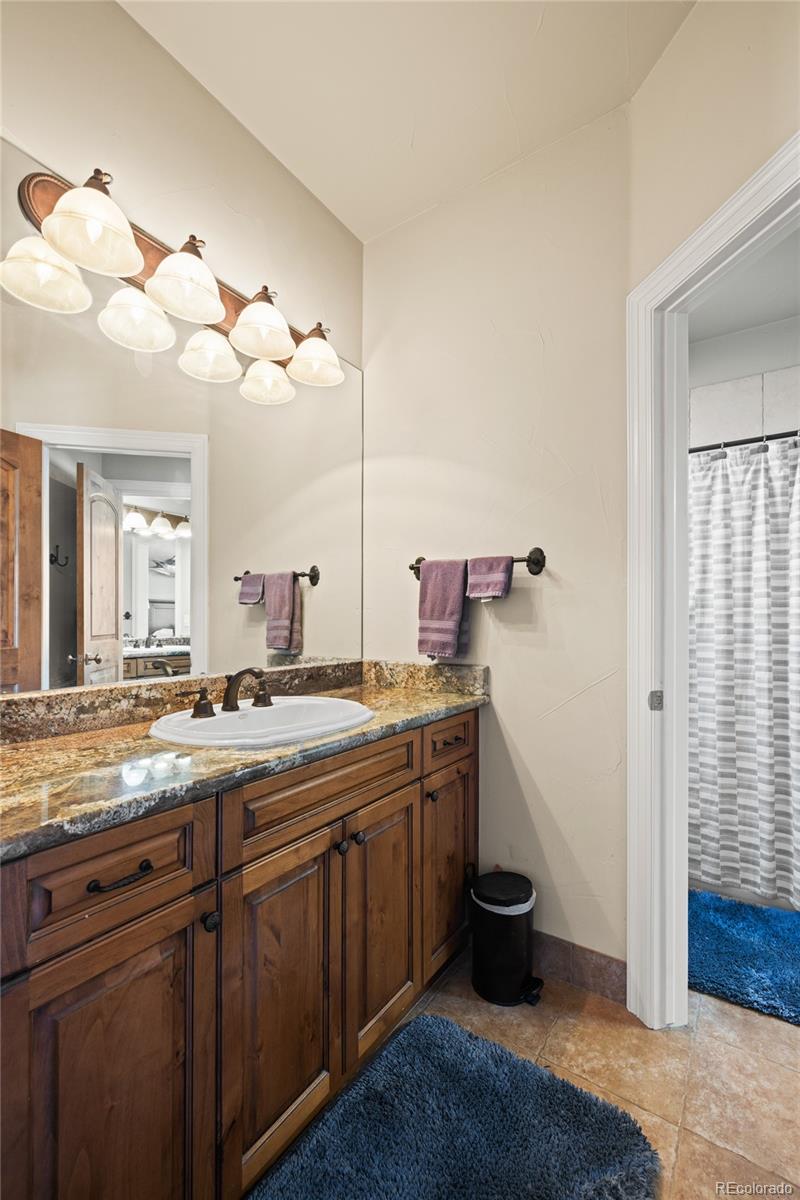 8751 Crooked Stick Place Lone Tree, CO 80124 - Photo 44 of 50 a kitchen with a sink and a stove
