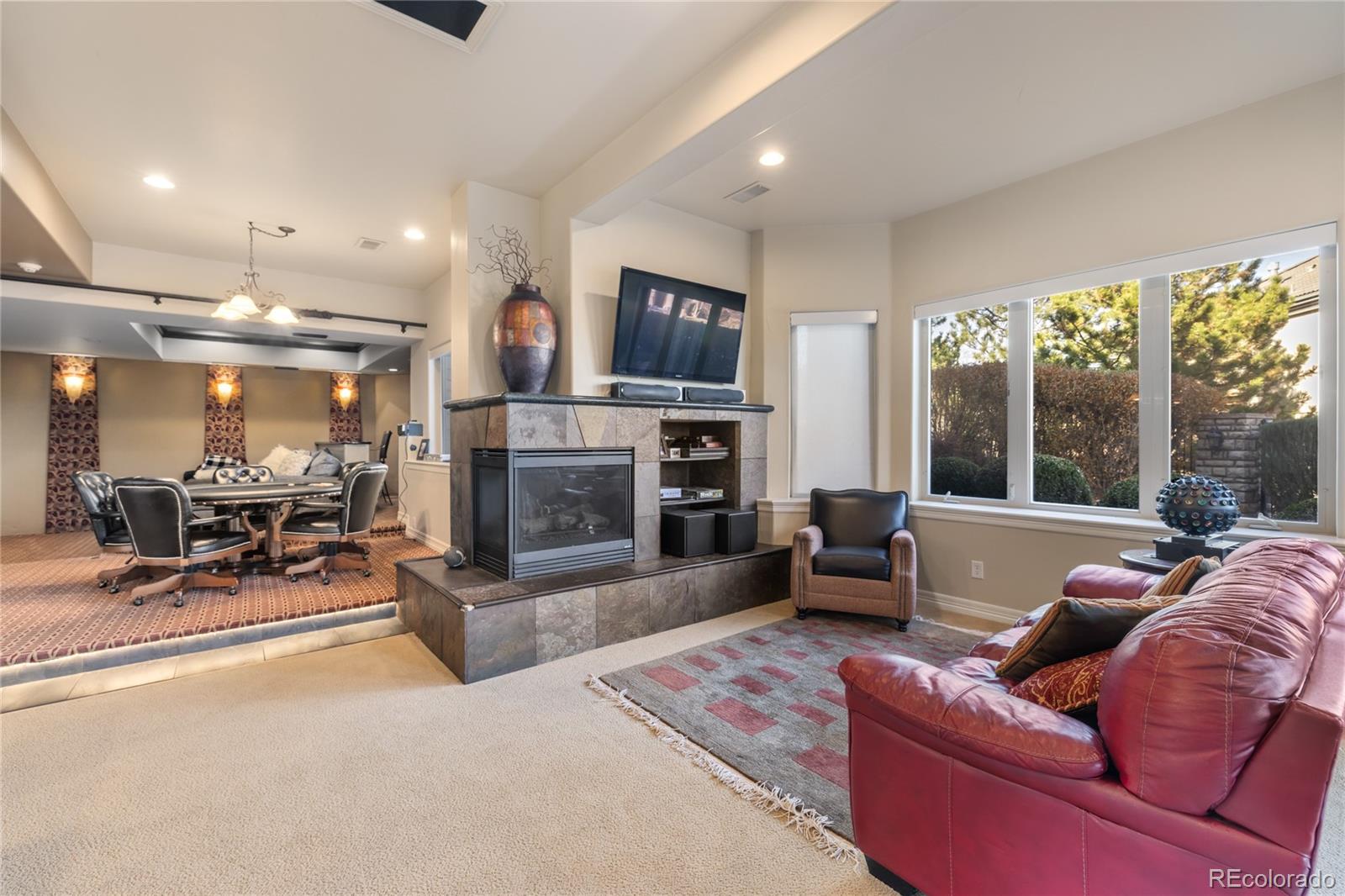 8751 Crooked Stick Place Lone Tree, CO 80124 - Photo 49 of 50 a living room with furniture and a fireplace