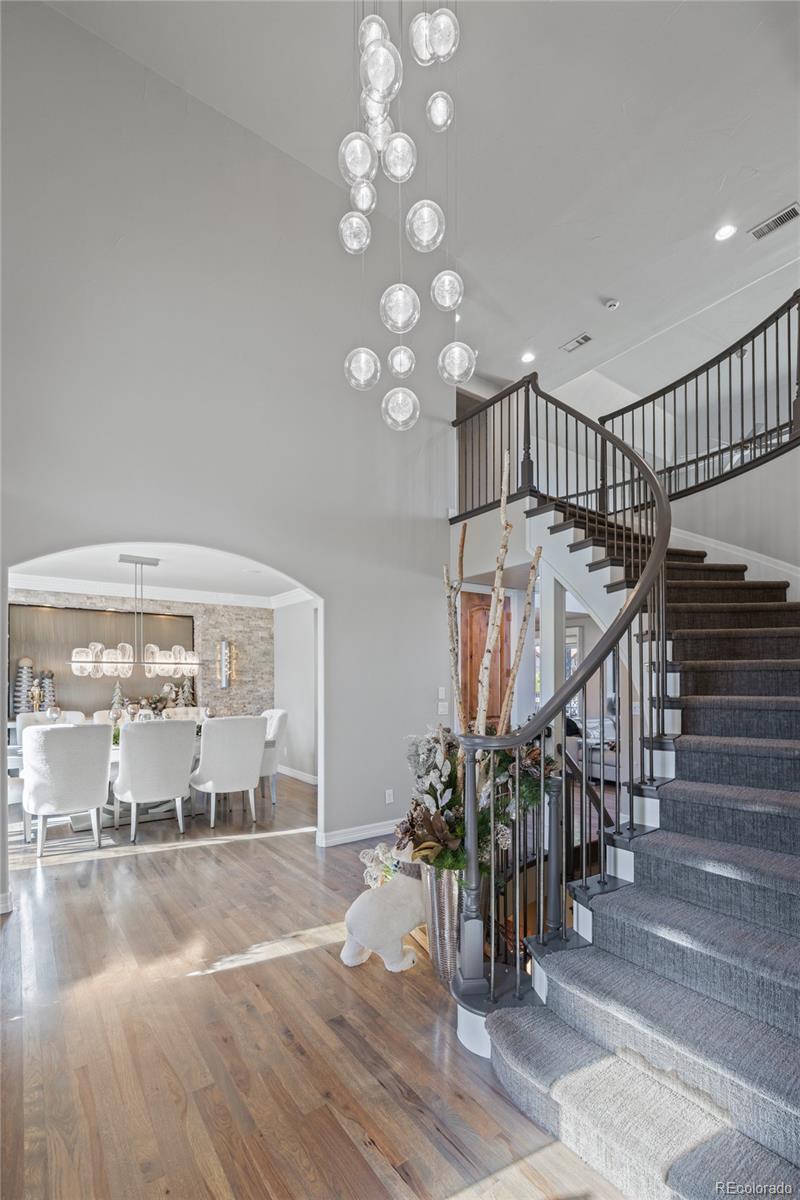 8751 Crooked Stick Place Lone Tree, CO 80124 - Photo 6 of 50 a view of entryway and hall with wooden floor