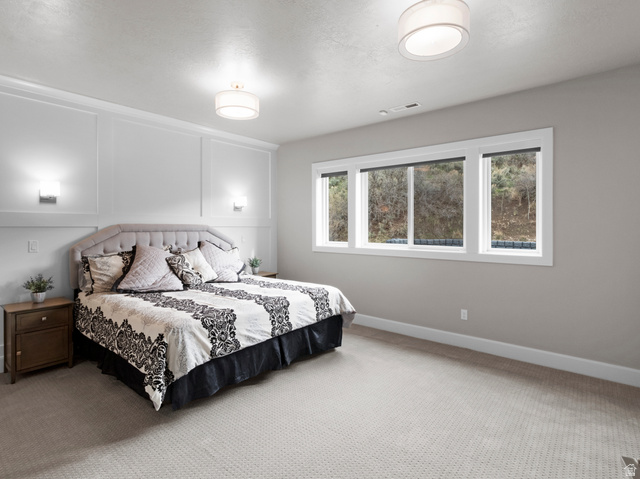 614 East High Lane Alpine, UT 84004 - Photo 60 of 75 Bedroom with a decorative wall and carpet