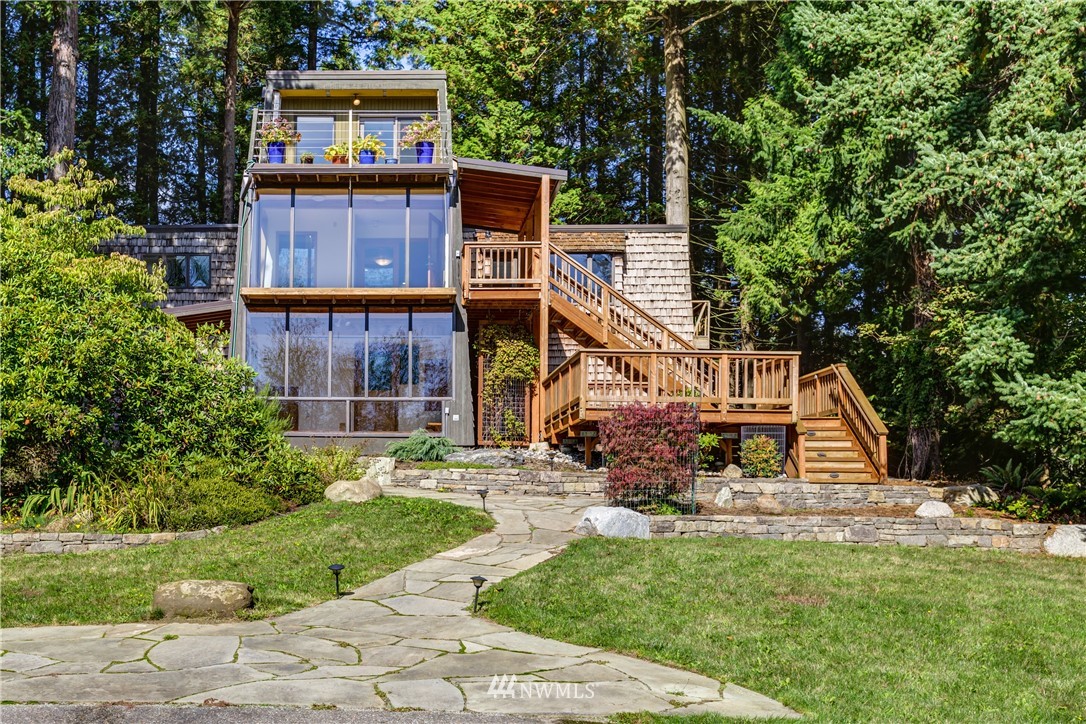 5852 Storr Road Ferndale, WA 98248 - Photo 2 of 25 a view of a house with a yard and hanging chair