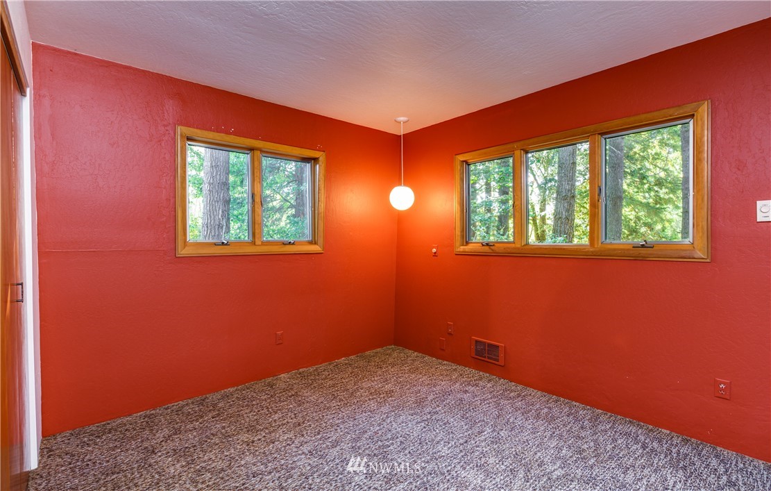 5852 Storr Road Ferndale, WA 98248 - Photo 17 of 25 a view of an empty room with a window