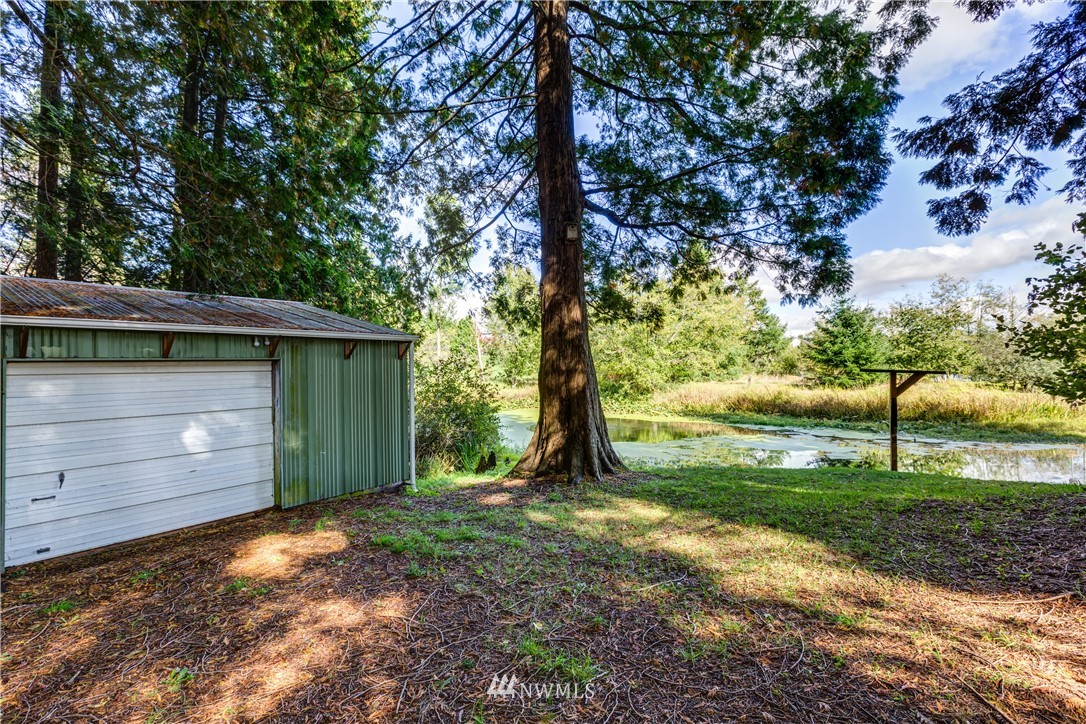 5852 Storr Road Ferndale, WA 98248 - Photo 21 of 25 a view of backyard and tree
