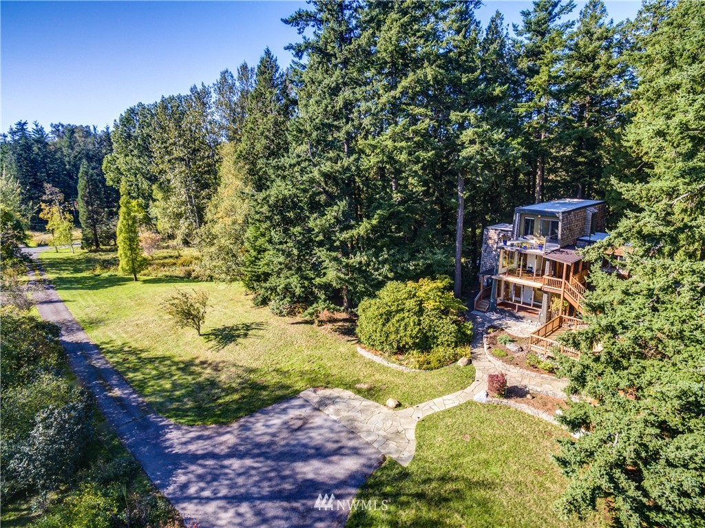 5852 Storr Road Ferndale, WA 98248 - Photo 22 of 25 a backyard of a house with a yard and outdoor seating