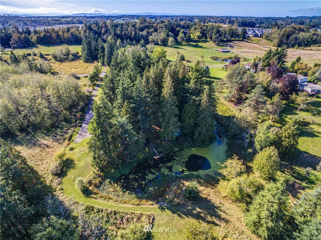 5852 Storr Road Ferndale, WA 98248 - Photo 24 of 25 a view of a lake with a house